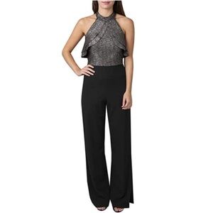bebe foil Black and Silver Ruffle Halter lined Jumpsuit size 10